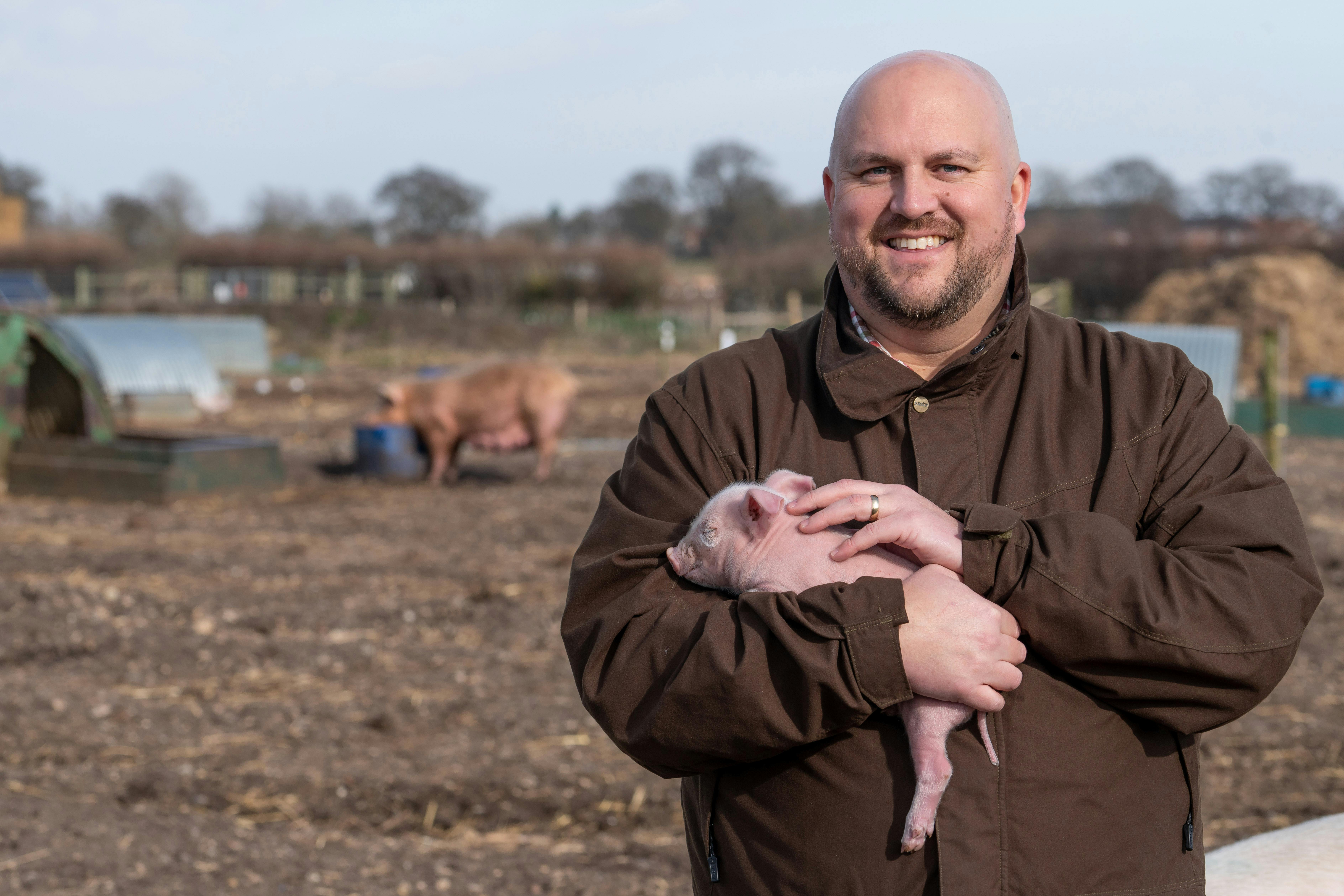 Ryan Lincoln, Partner, Lovewell Blake with a pig