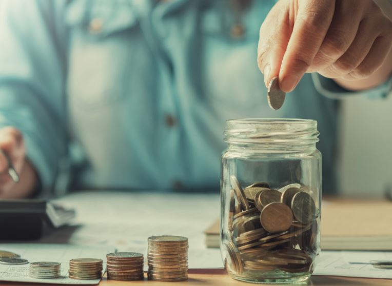 Stock image of someone saving money