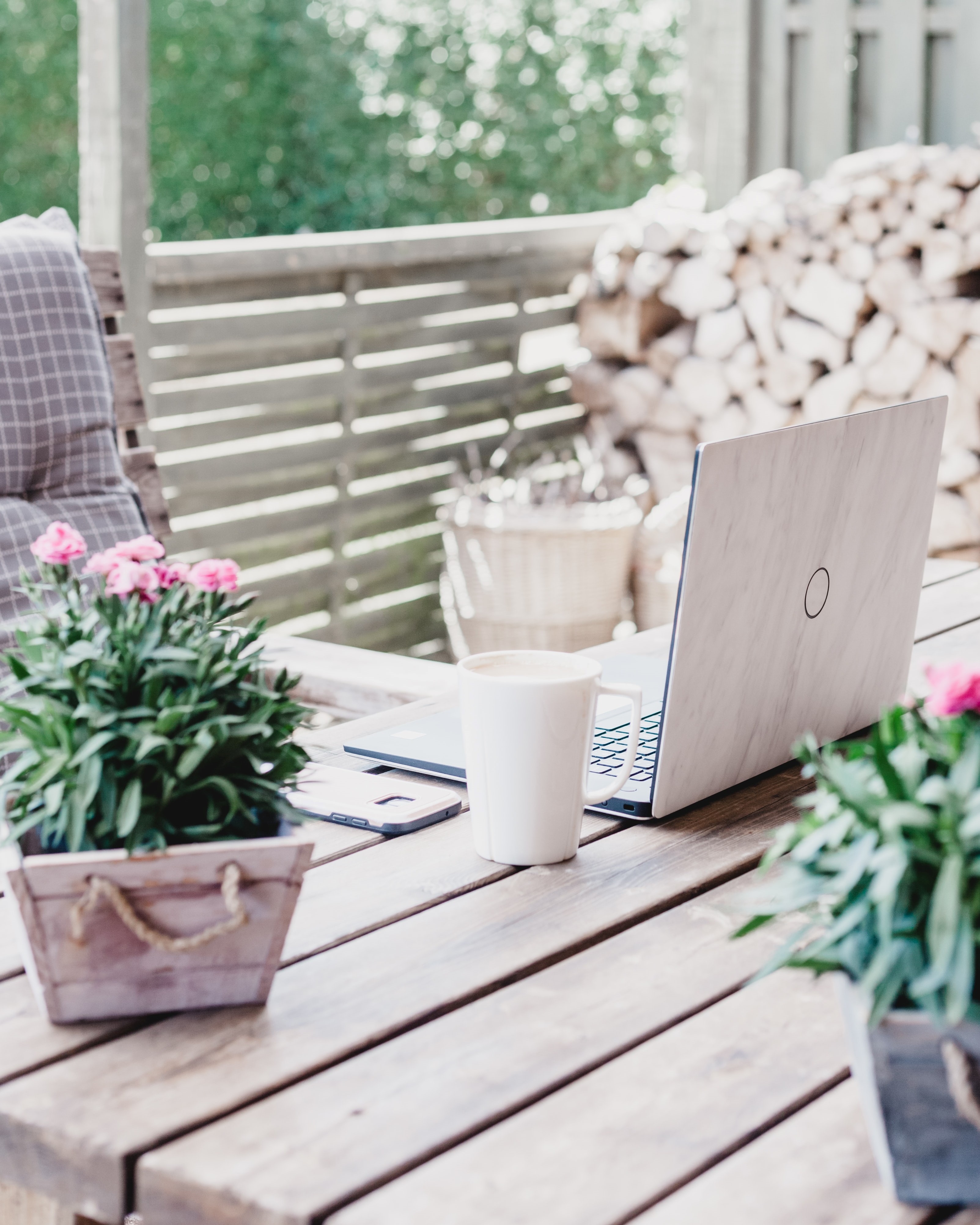 Laptop on some garden furniture